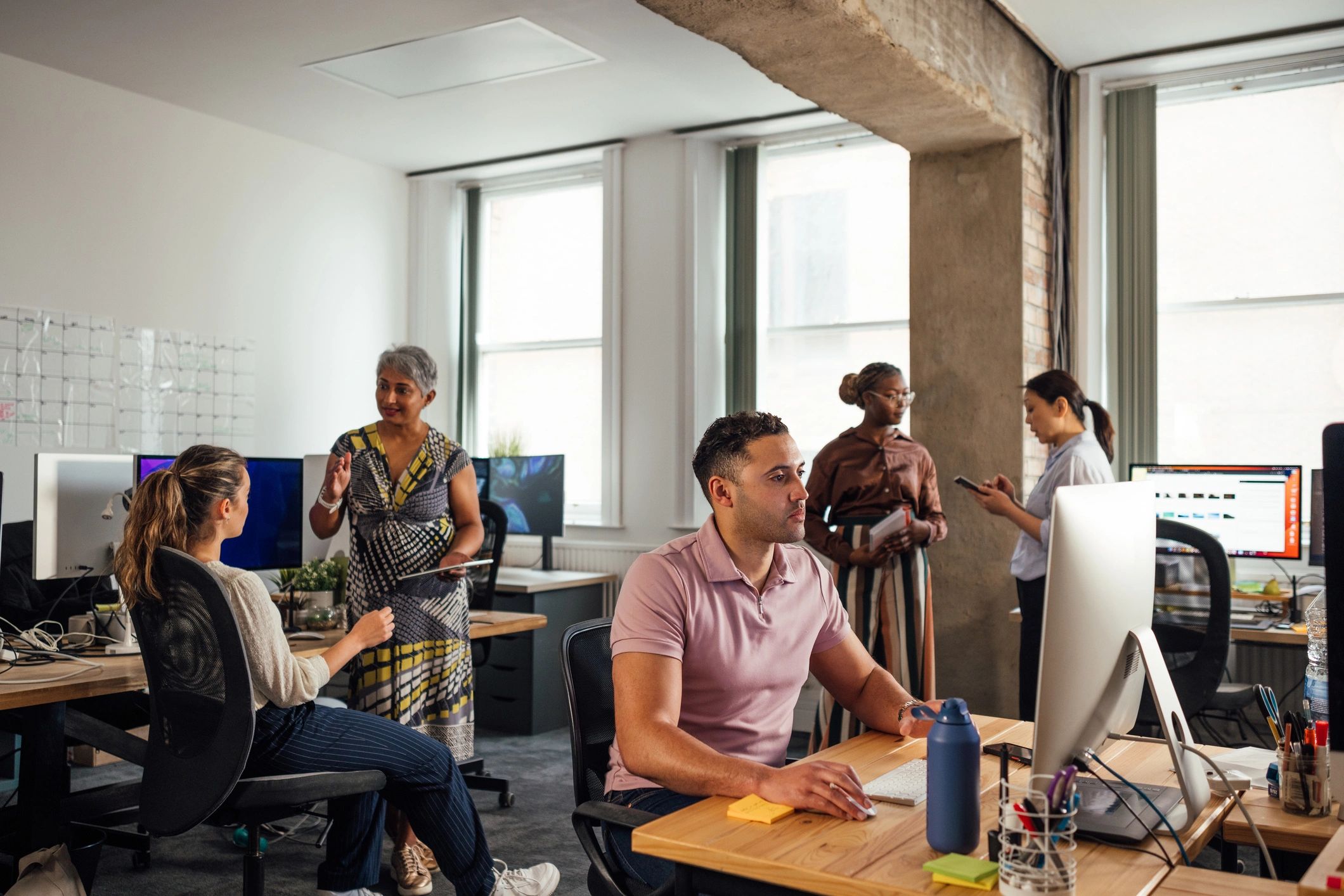 Business team collaborating in a professional technology office